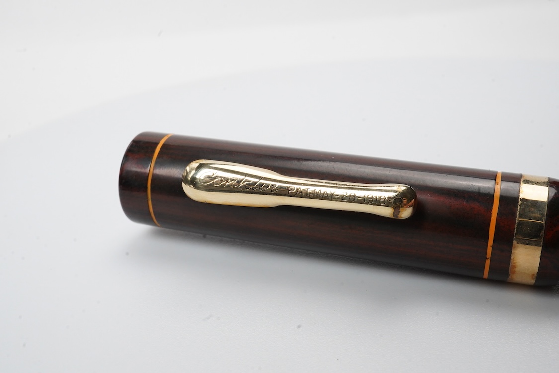 A Conklin Endura woodgrain lever filler fountain pen in near mint condition